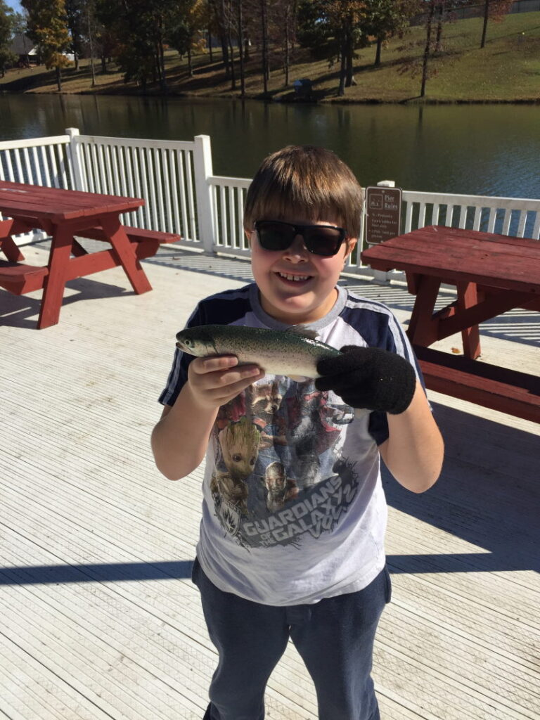 Take a kid fishing 
Holding trout and smiling big