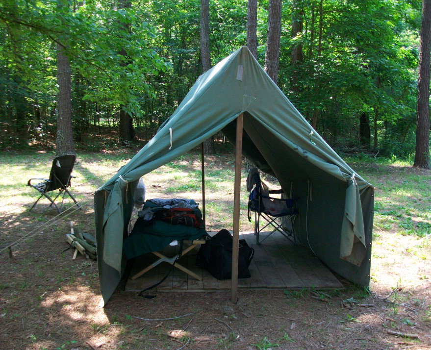 To sleep better while camping try using a cot. Canvas tent with a cot