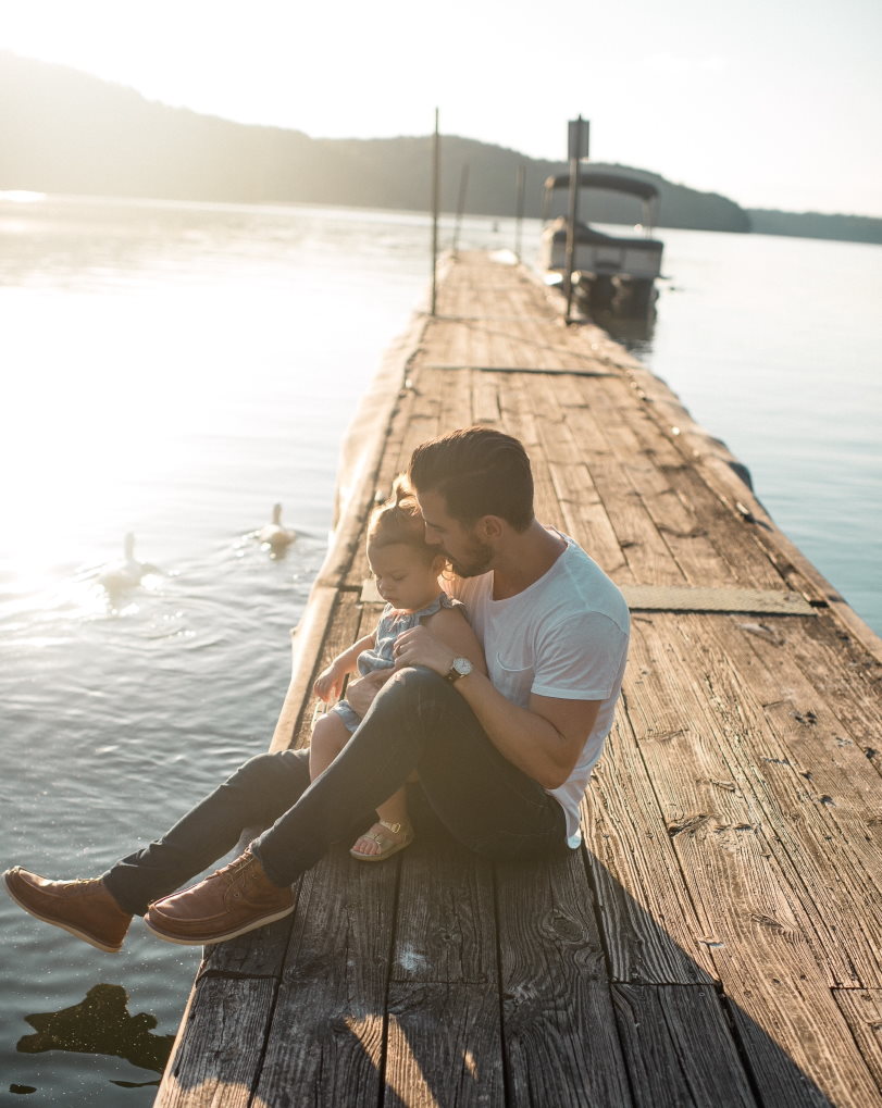 Father with daughter on dock