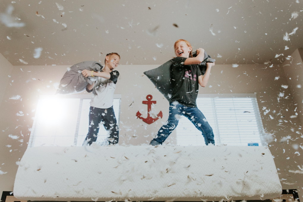 Boys in a pillow fight - Active parenting styles