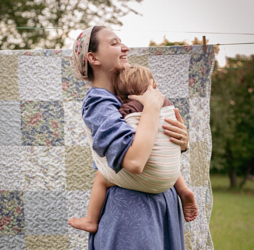 Use a sling or backpack to make carrying your toddler more bearable